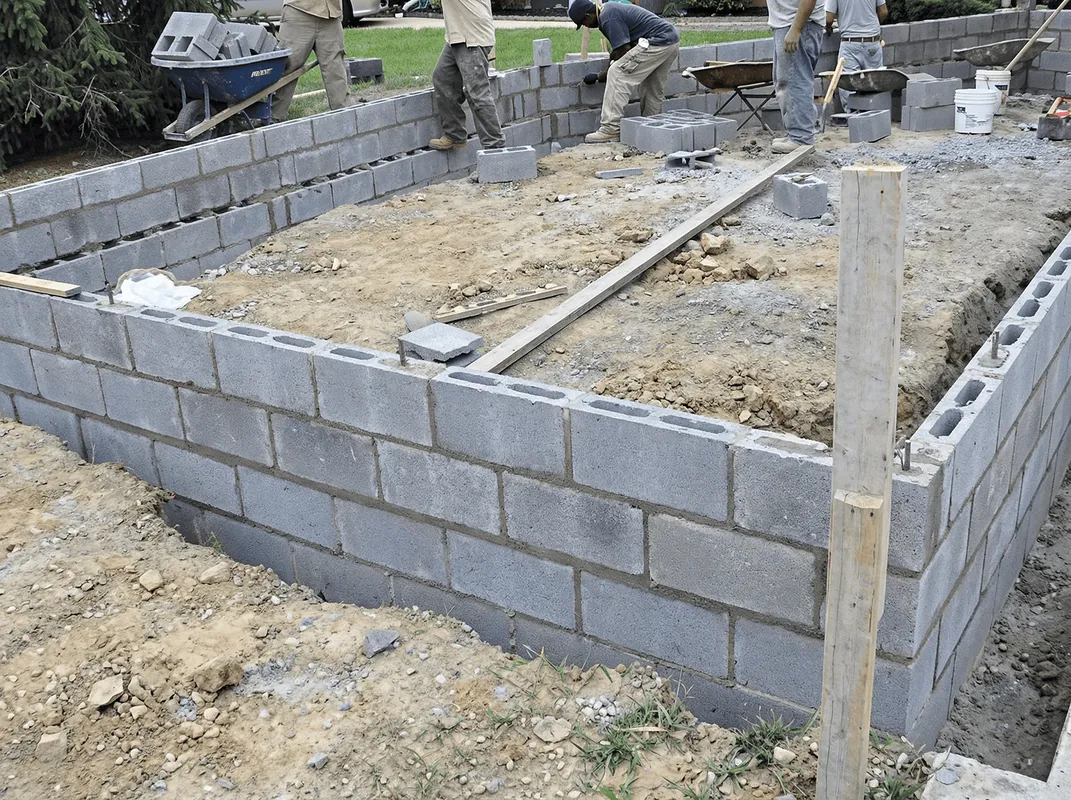 Professionals building a foundation with blocks in Myrtle Beach, SC