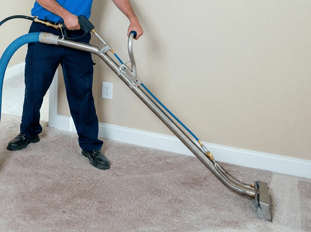 Professional operating a liquid removal machine on a carpeted floor in Myrtle Beach, SC
